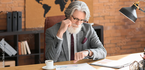 Mature bearded businessman ...