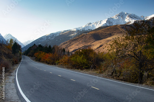 Empty Highway in mountains in autumn evening