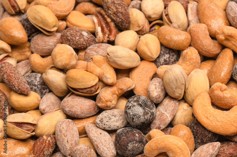 A group of almonds, pistachios, walnuts, macadamia, cashews. A group of almonds, pistachios, walnuts, macadamia, cashews.