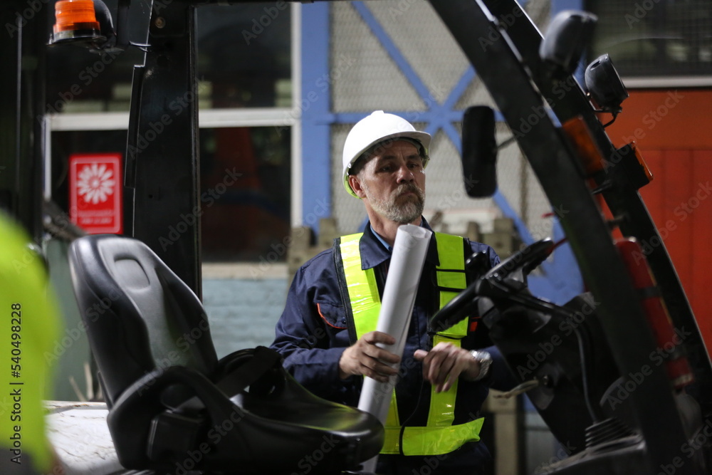 Man engineer standing on construction site or equipment maintenance work site. Man engineer standing on construction site or equipment maintenance work site.