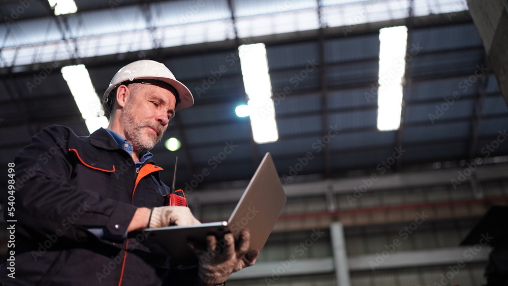 Factory engineer or foreman worker maintaining check equipment parts in factory. Factory engineer or foreman worker maintaining check equipment parts in factory.