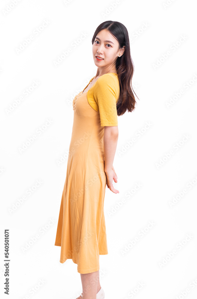 A beautiful, stylish woman in a yellow dress