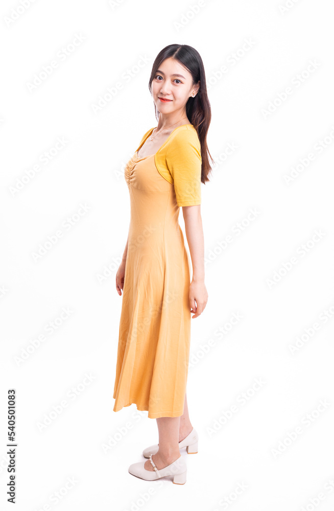 A beautiful, stylish woman in a yellow dress A beautiful, stylish woman in a yellow dress