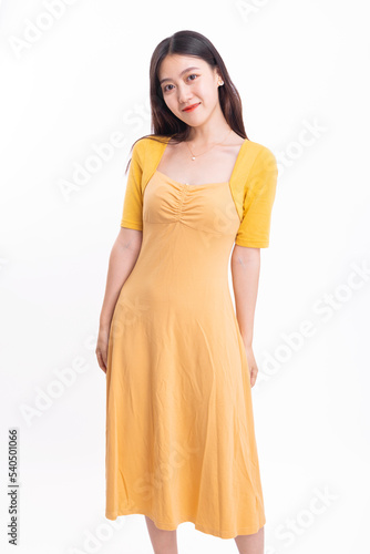 A beautiful, stylish woman in a yellow dress