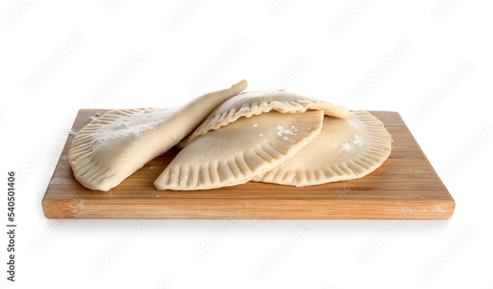 Board with raw chebureks on white background