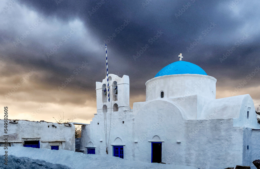 Storm clouds at twilight over a Greek Orthodox church at Apollonia town on the island of Sifnos