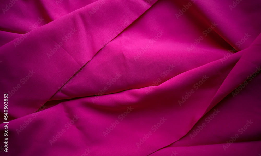 Photo of a pink color texture. A piece of pink fabric for the production of clothing. Sale of textiles. Photo of a pink color texture. A piece of pink fabric for the production of clothing. Sale of textiles.