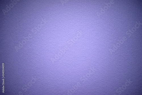 Purple texture of soft cardboard. Pure purple background. A clean place for a congratulatory text. Felt fabric for production.