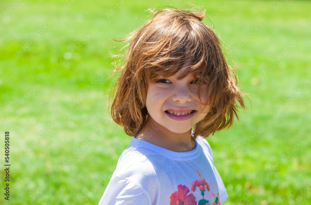 portrait of a happy girl in the park portrait of a happy girl in the park