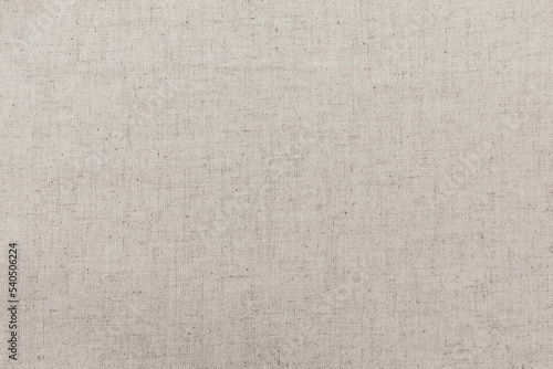 White and beige linen cotton canvas texture closeup. Flat lay photo for background and pattern. 