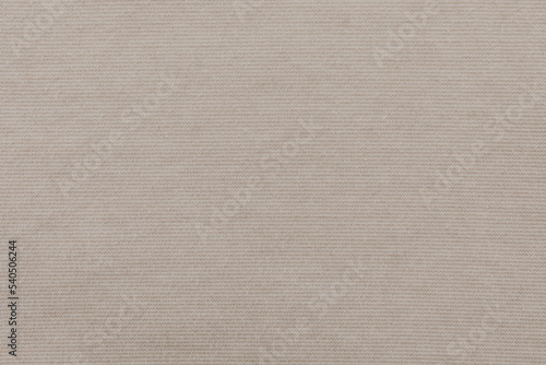 Beige lined fabric textured. Light white and beige stripes. Flat lay top view. Closeup background. 