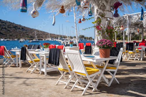 chairs and served table on the fancy beach restaurant