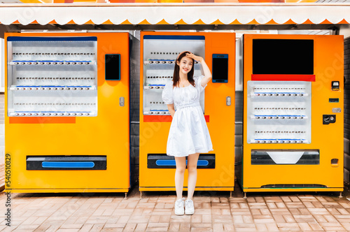 Pretty girl at the vending machine