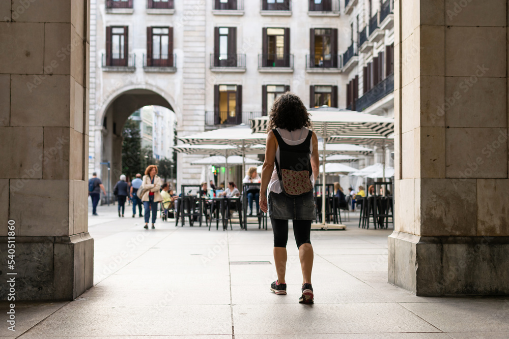 Tourist entering the Plaza Porticada in Santander