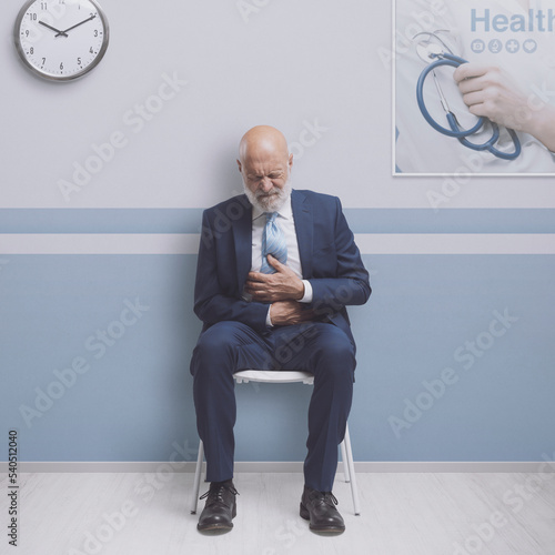 Man with abdominal pain at the clinic photo
