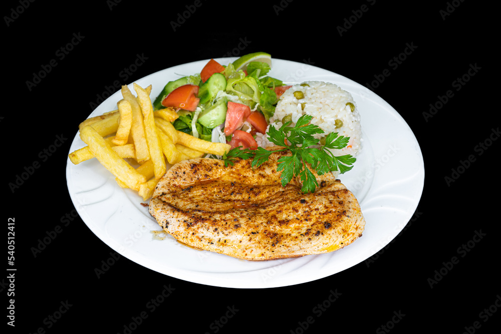 Grilled chicken breast with rice, salad and french fries in a white plate Grilled chicken breast with rice, salad and french fries in a white plate