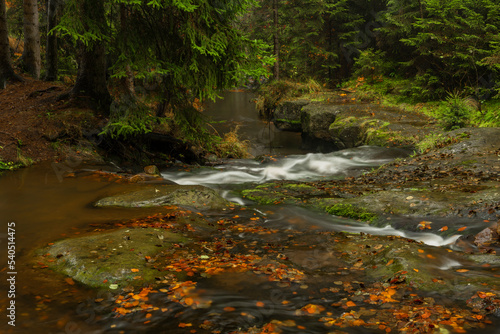 Hamersky creek with waterfalls in Luzicke mountains in color autumn day