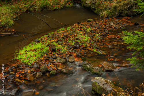 Hamersky creek with waterfalls in Luzicke mountains in color autumn day photo