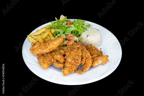 Fried chicken tenders in a white plate