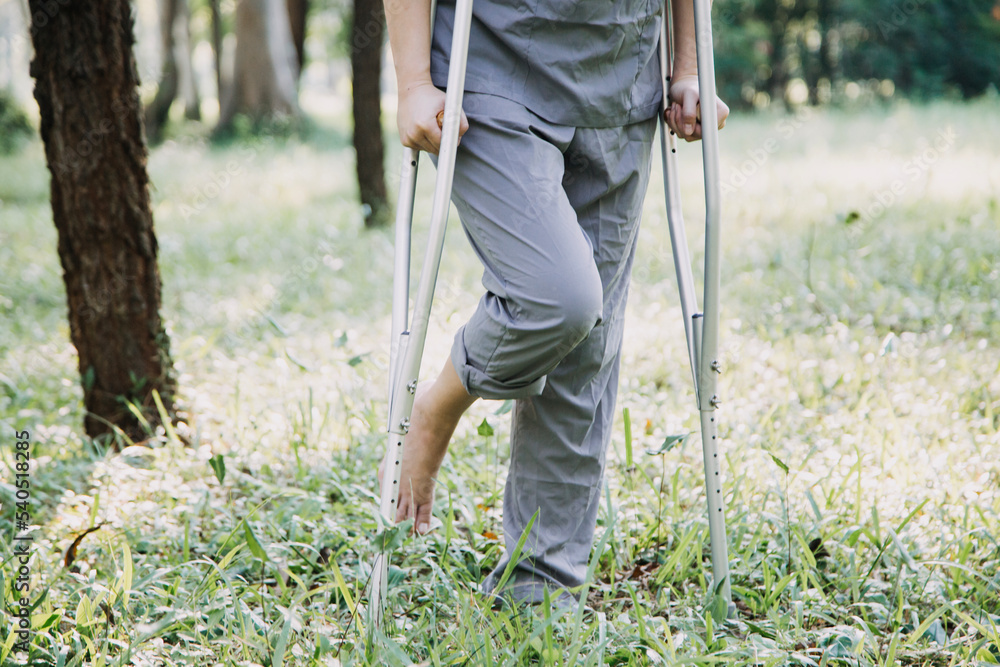 young asian physical therapist working with senior woman on walking with a walker young asian physical therapist working with senior woman on walking with a walker