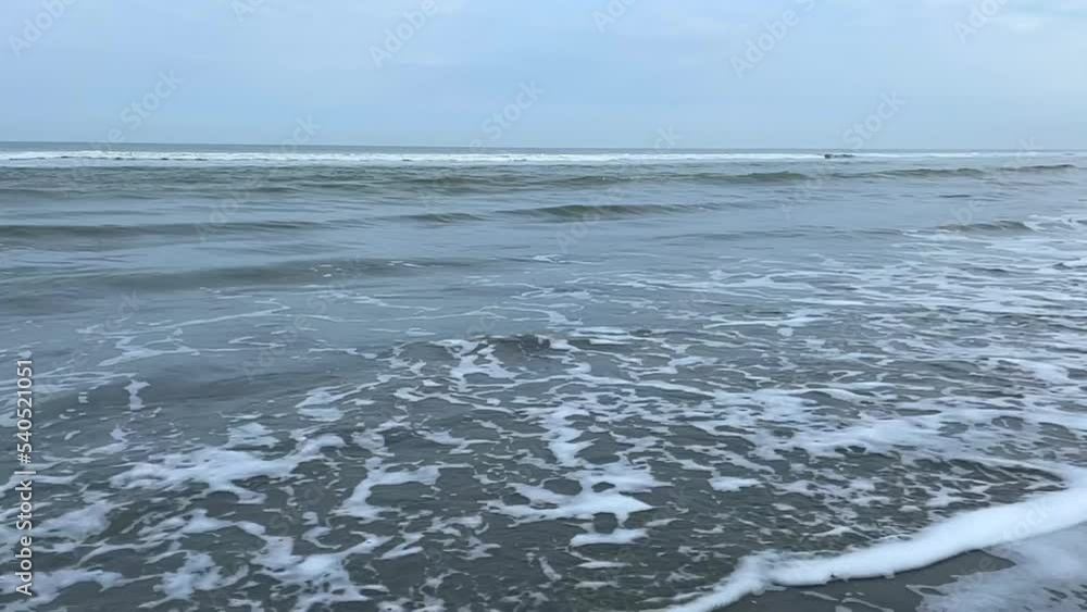 Waves on the beach of the German island of Juist Waves on the beach of the German island of Juist