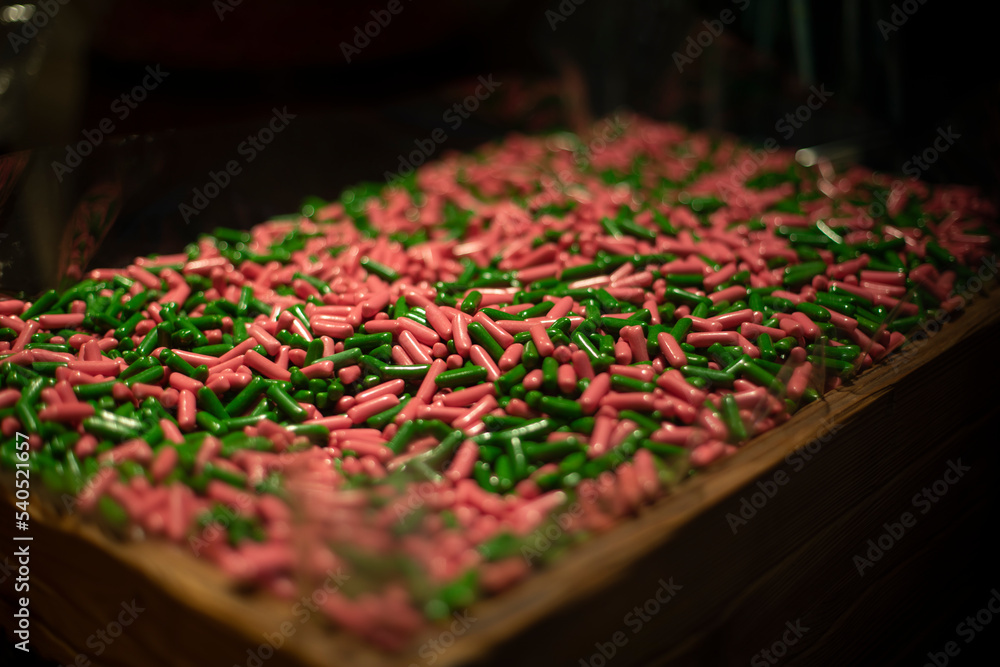 Fototapeta premium Lots of marmalade in drawer. Chewing gum in store. Sale of sweets.