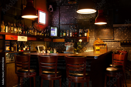 Dark moody interior of modern european pub.