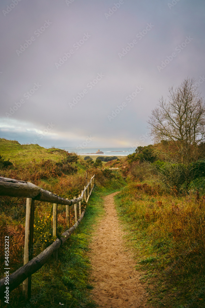 A beautiful path that leads through sand dunes in western Jersey backing the southern end of St Ouen's Bay A beautiful path that leads through sand dunes in western Jersey backing the southern end of St Ouen's Bay