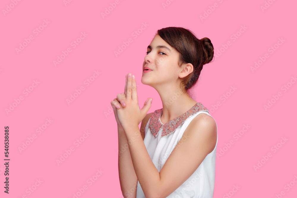 Brunette girl imitating blowing after gun shot Brunette girl imitating blowing after gun shot