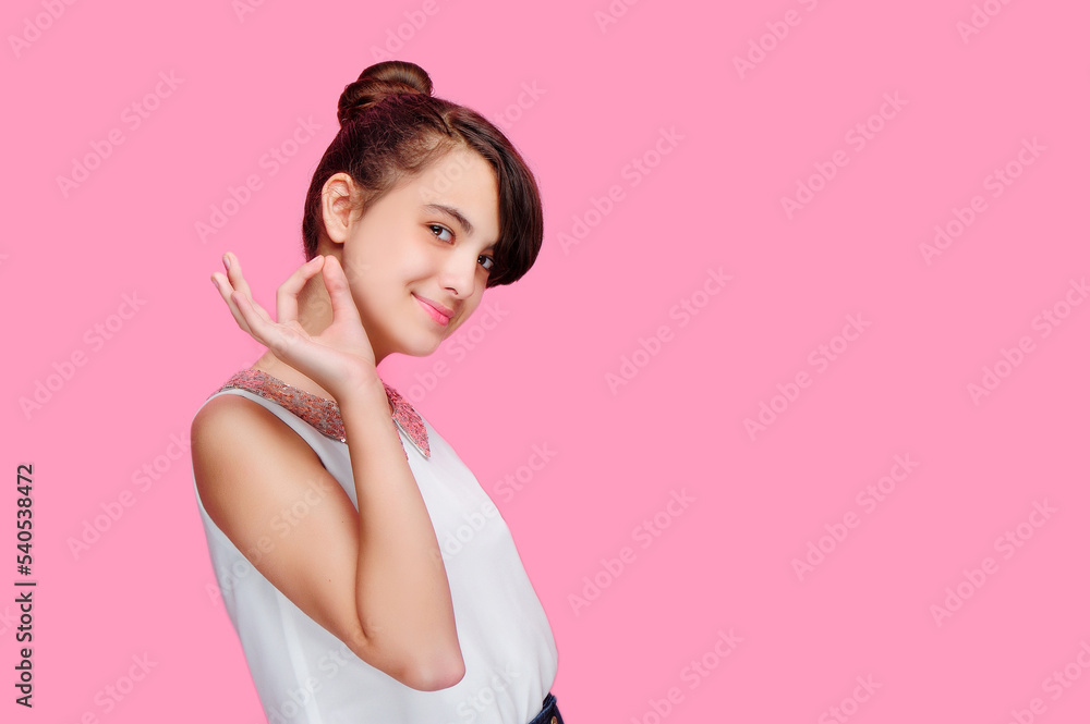 Pretty girl showing ok gesture isolated on pink background Pretty girl showing ok gesture isolated on pink background