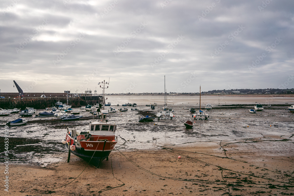 Boats moored at the seaside on cloudy day Boats moored at the seaside on cloudy day