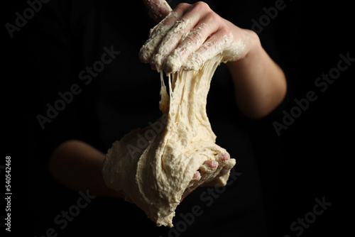 Creation of liquid dough, massage with hands. Sourdough close-up.