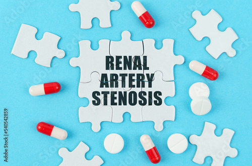 On a blue background, pills, capsules and puzzles with the inscription - Renal artery stenosis photo