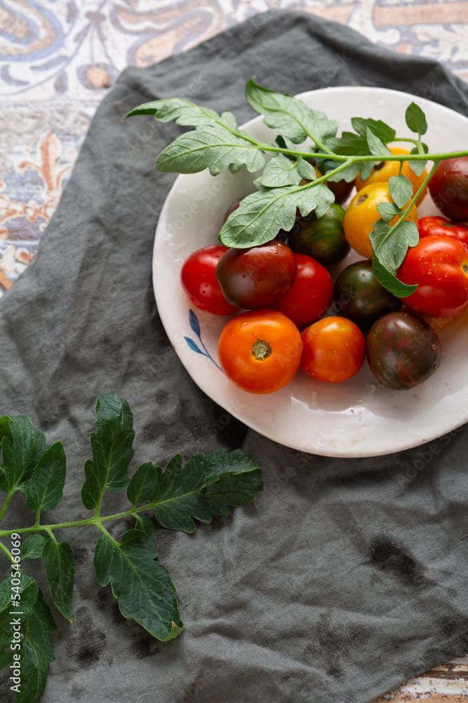 Top view of healthy local heirloom tomatoes on plate healthy food