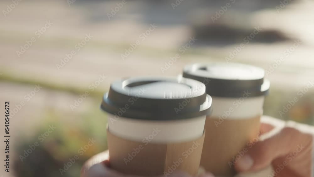 Need more coffee today. Close up cropped man holding in hand holder two takeaway clear empty blank cup coffee. Service concept Need more coffee today. Close up cropped man holding in hand holder two takeaway clear empty blank cup coffee. Service concept