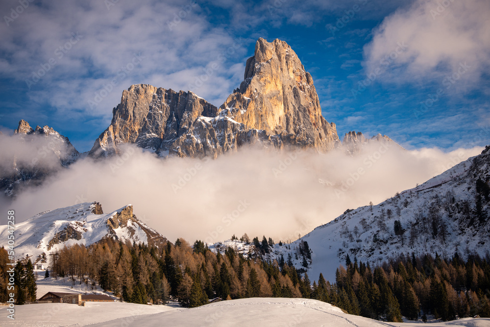 aerial view of Pale di San Martino and Passo Rolle covered with snow in ...
