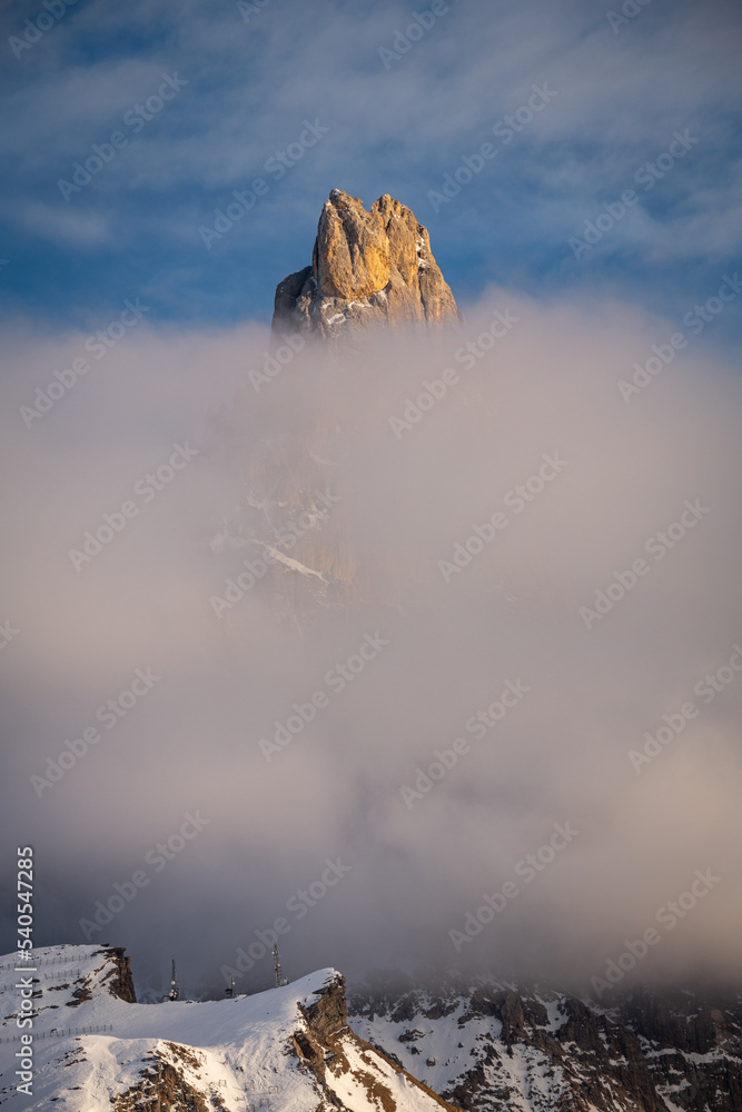 aerial view of Pale di San Martino and Passo Rolle covered with snow in ...
