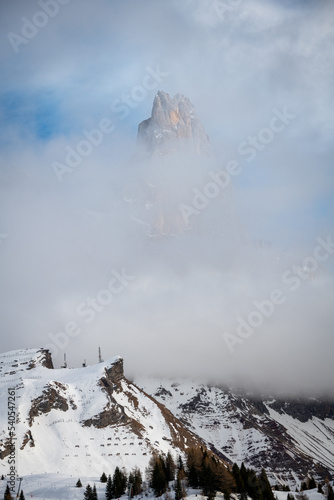 aerial view of Pale di San Martino and Passo Rolle covered with snow in winter, Italy