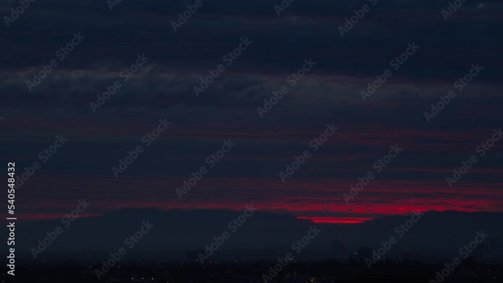 Aerial Lockdown Time Lapse Shot Of Pink And Red Dramatic Sky Over City At Sunset - Santa Monica, California Aerial Lockdown Time Lapse Shot Of Pink And Red Dramatic Sky Over City At Sunset - Santa Monica, California