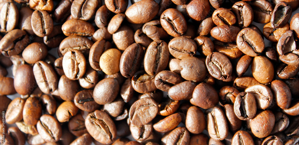 close-up of coffee beans as background, top view on brown coffee beans, coffee background close-up of coffee beans as background, top view on brown coffee beans, coffee background