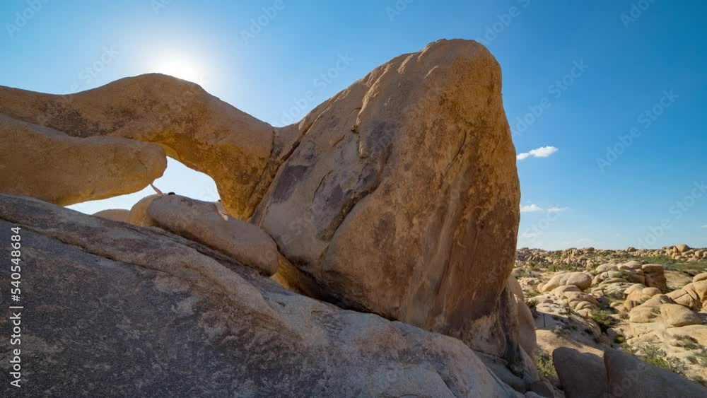 Time Lapse Lockdown Shot Of People Exploring By Rocks At Joshua Tree National Park During Sunny Day Time Lapse Lockdown Shot Of People Exploring By Rocks At Joshua Tree National Park During Sunny Day