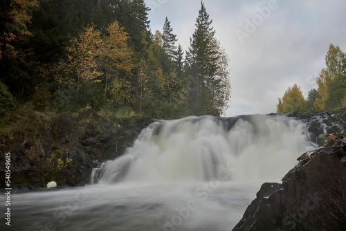 Stormy stream of Kivach waterfall in autumn Karelia