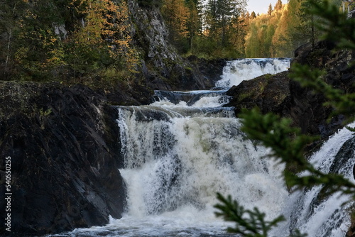 Stormy stream of Kivach waterfall in autumn Karelia