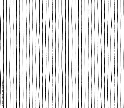 Brush drawn thin vertical lines seamless pattern. Decorative ornament with handdrawn lines. Grungy ink doodles with stripes. Black and white geometric pattern. Vertical parallel straight brush strokes
