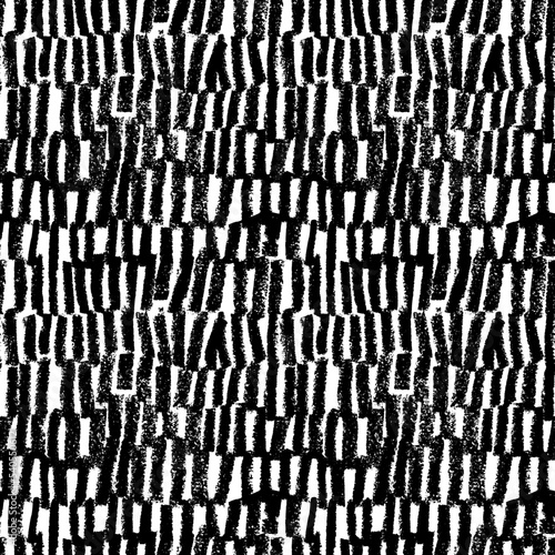 Vertical bold charcoal lines seamless pattern. Hand drawn regular dashed strokes with grainy texture. Black paint dry brushstrokes in a row. Abstract monochrome vector geometric background.