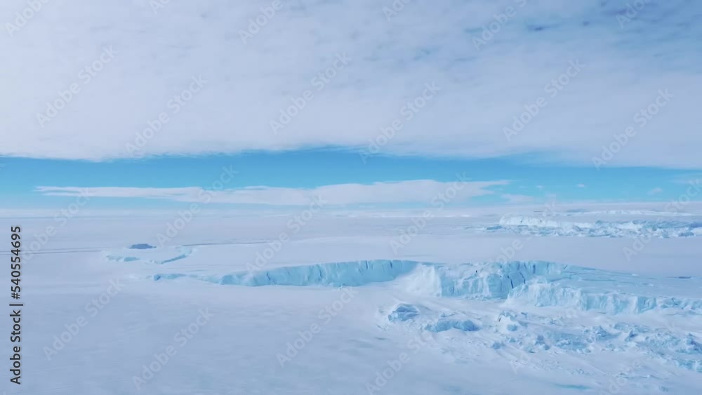 Frozen south pole. Desert white land of snow and ice drone shot. Snow covered antarctic surface aerial view flight. Frozen south pole. Desert white land of snow and ice drone shot. Snow covered antarctic surface aerial view flight.