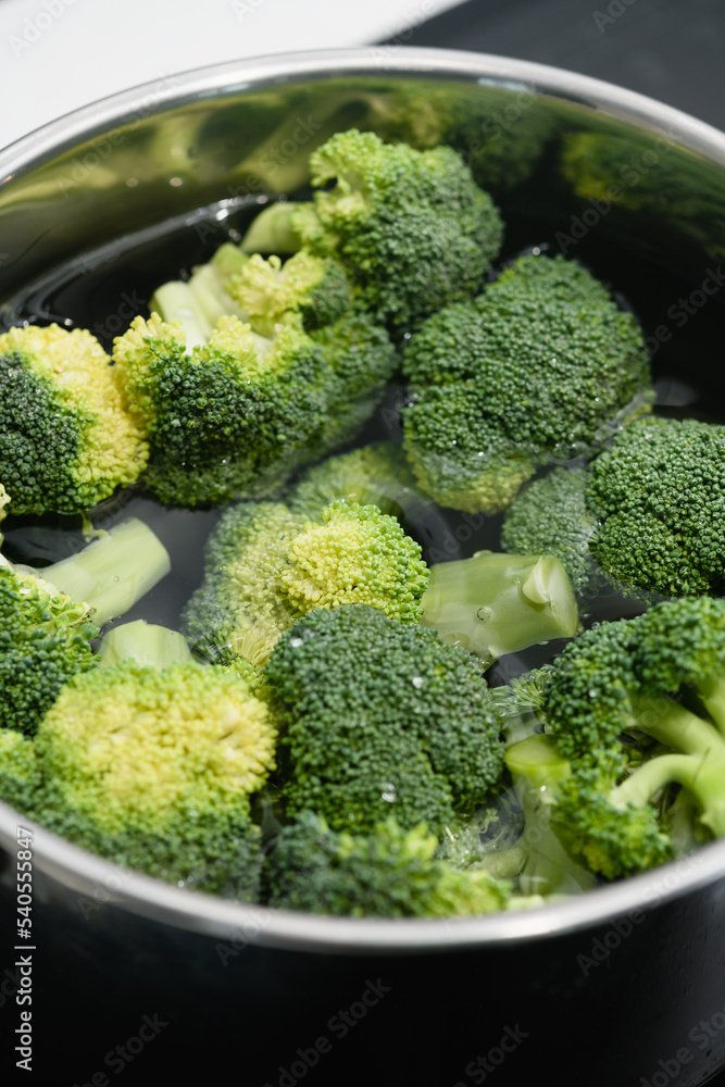 Fresh green broccoli cooked boiled in a pan. Fresh green broccoli cooked boiled in a pan.