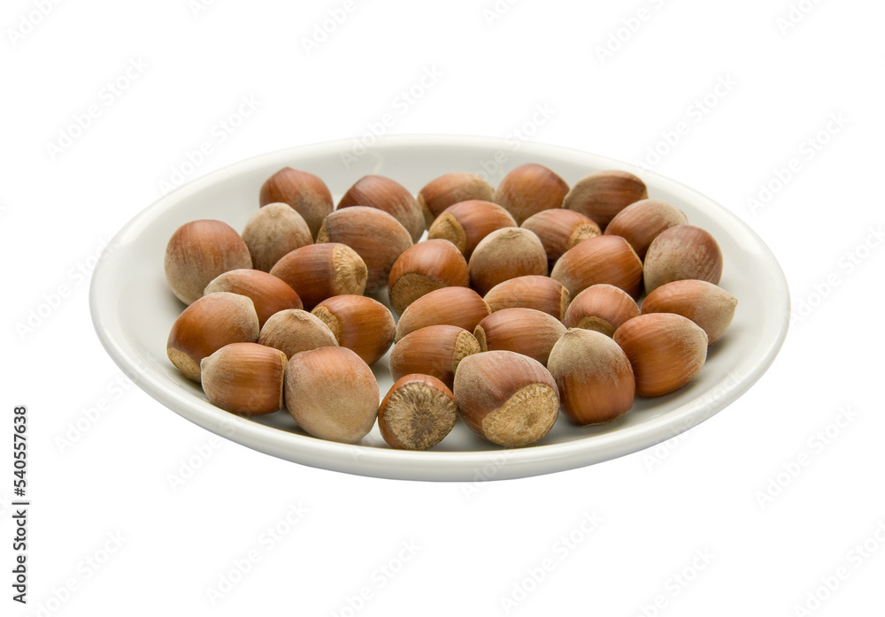 Nuts in a plate, isolated on white background Nuts in a plate, isolated on white background
