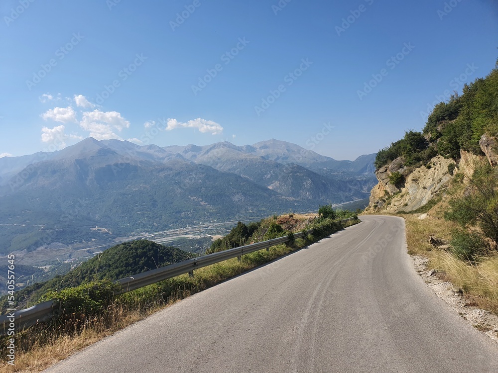 Perfect Road for a roadtrip - Street in the mountains: Amazing view into the valley near Ioannina. Northern Greece.