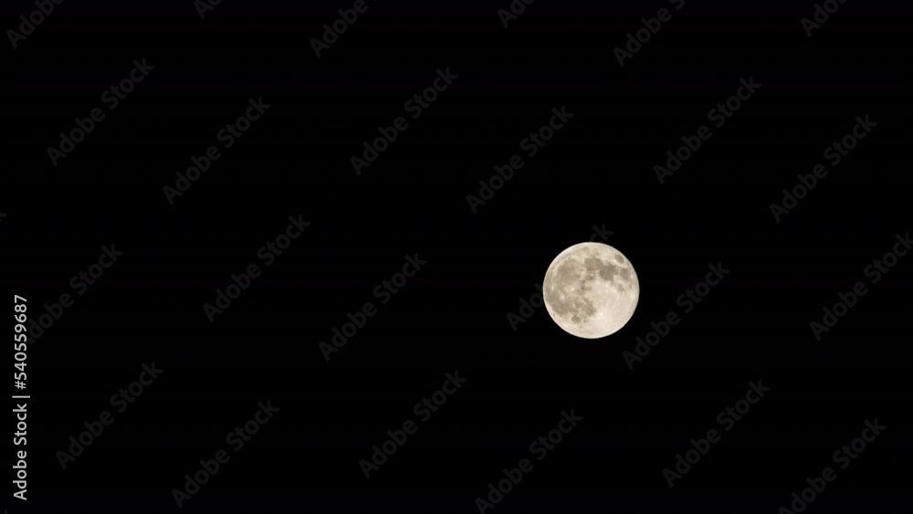 Time Lapse Shot Of Glowing Moon Moving Against Dark Sky At Night - Joshua Tree, California Time Lapse Shot Of Glowing Moon Moving Against Dark Sky At Night - Joshua Tree, California